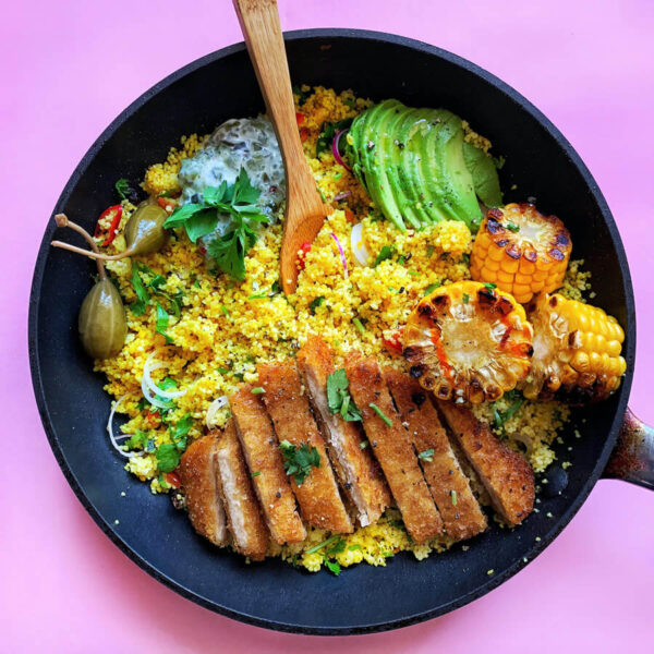 Fried soy schnitzel with golden saffron couscous and avocado